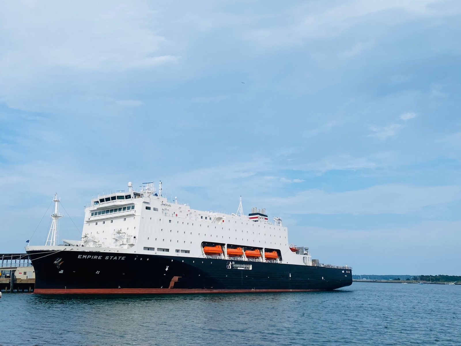The Empire State training vessel docked in Portland, ME, under clear skies